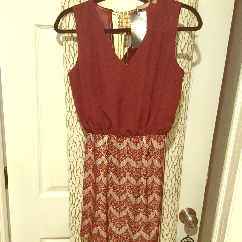 Open back cocktail dress with gold detail